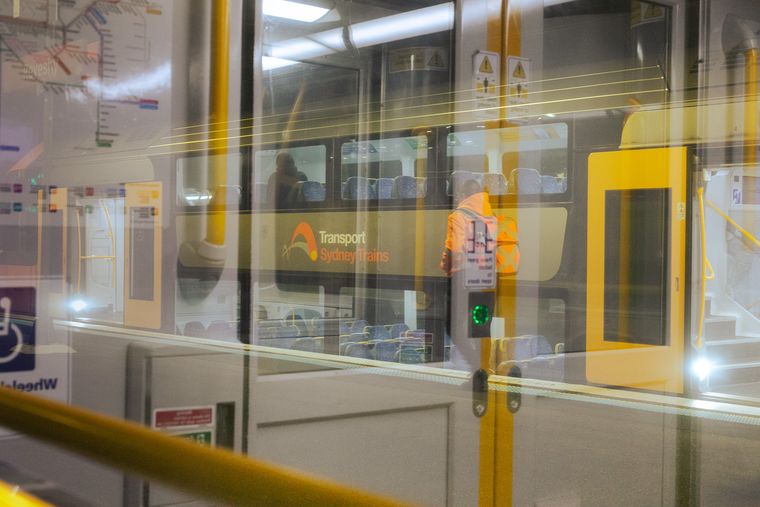 Unknown train station, Sydney | Reflections in carriage window | 2025